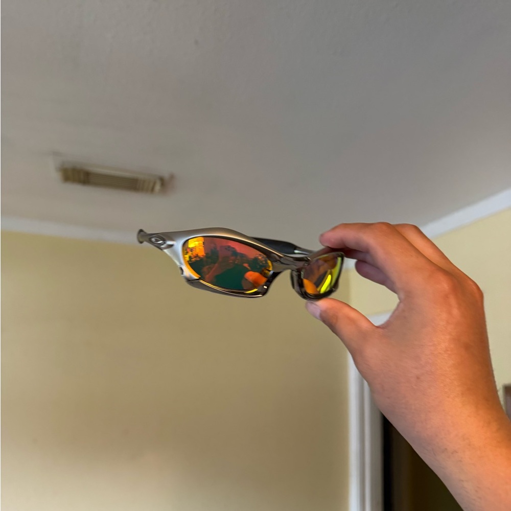 Sporty Metallic Sunglasses with Orange Mirrored Lenses Oakley Oakleys